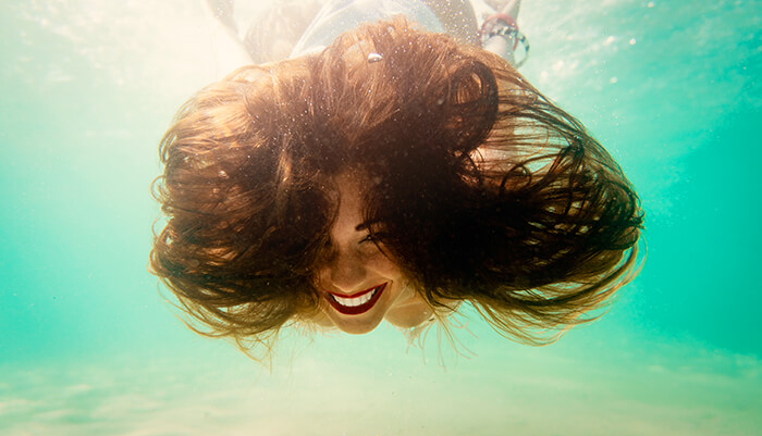 crazy hair of a girl under the swimming pool